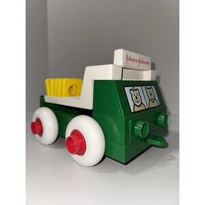 VTG Johnson & Johnson Green Plastic Toy Truck W Stackable Shapes 1983 Bears